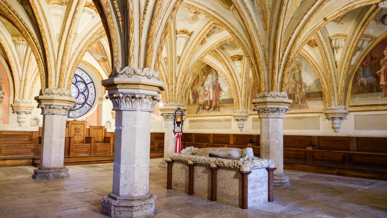 Heiligenkreuz Abbey, © Elisabeth Fürst Interior view of the chapter house in Heiligenkreuz Abbey with Gothic vaults and a stone sarcophagus.